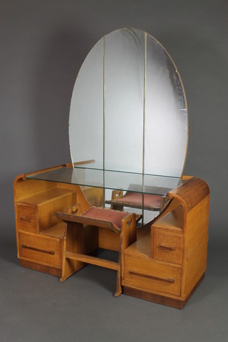 Grange, a 1930's Art Deco oak dressing table with oval plate mirror, fitted a plate glass panel flanked by 2 short and 1 long drawer together with matching dressing table stool, the reverse with paper label marked design no. B1012, 64"h x 48"w x 19"d 