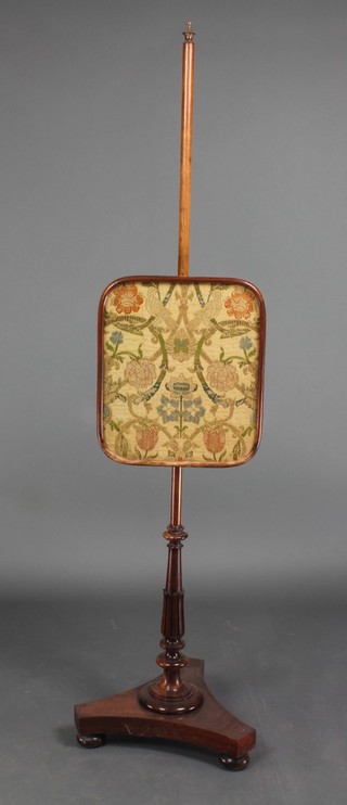 A William IV rosewood pole screen with rectangular tapestry banner, raised on a turned and reeded column with triform base, raised on pad feet 60"h x 16"w 