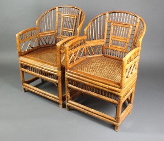 A pair of 1920's Chinese bamboo arm chairs with woven cane seats