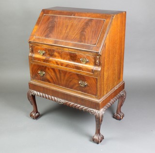 A Chippendale style mahogany bureau, the fall front revealing a well fitted interior above 2 long drawers, raised on cabriole claw and ball supports with gadrooned decoration 38"h x 27"w x 16"d 