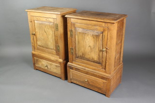 A pair of 17th Century style elm cabinets fitted cupboards with H framed hinges, the base fitted a drawer 34"h x 22"w x 13"d 