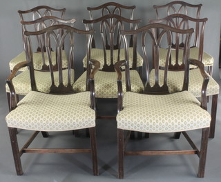 A set of 8 Hepplewhite style mahogany dining chairs with upholstered seats, raised on square tapering supports with H framed stretcher