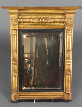 A Regency style rectangular bevelled plate pier mirror contained in a gilt blackened frame with moulded cornice 27"h x 22"w x 5"d 