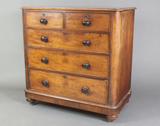 A Victorian mahogany D shaped chest of 2 short and 4 long drawers with tore handles and brass escutcheons, raised on bun feet 42" 1/2"h x 42 1/2"w x 31 1/2"d 