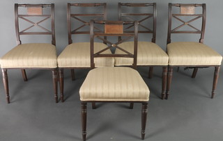 A set of 5 Georgian mahogany bar back dining chairs with X framed mid rails and upholstered seats, raised on turned supports 