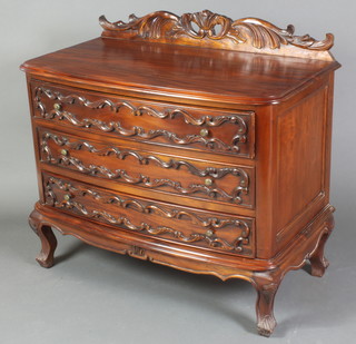 A French style carved hardwood chest with carved and pierced back, fitted 3 long drawers with metal handles, raised on cabriole supports 36"h x 39 1/2"w x 21"d 