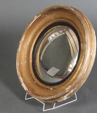 A 19th Century circular convex plate wall mirror contained in a gilt frame 18 1/2" 