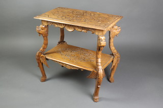 A 19th Century rectangular carved Italian walnut 2 tier occasional table raised on griffin supports 28"h x 27 1/2"w x 15 1/2"d
