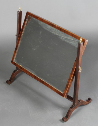 A 19th Century rectangular plate dressing table mirror contained in a mahogany swing frame 23"h x 23"w x 11"d 