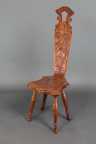 A carved oak spinning chair 