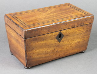 A 19th Century rectangular mahogany twin compartment tea caddy with ebonised stringing, raised on bun feet 4"h x 8"w x 4 1/2"w 