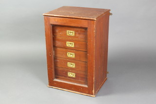 A Victorian pine collectors cabinet fitted 7 short drawers with countersunk brass handles enclosed by a glazed panelled door 36"h x 17 1/2"w x 14"d 