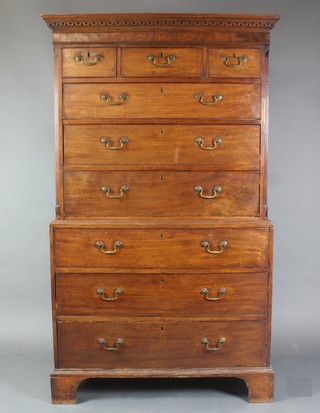 A Georgian mahogany chest on chest, the upper section with moulded Grecian key pattern cornice and canted corners, fitted 3 short drawers above 3 long drawers, the base fitted 3 long drawers with brass swan neck drop handles and escutcheons, raised on bracket feet 72"h x 41"w x 23"d 
