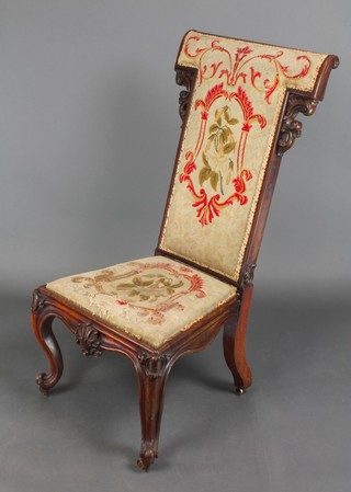 A Victorian rosewood Prie-Dieu chair with upholstered seat and back ,raised on cabriole supports 