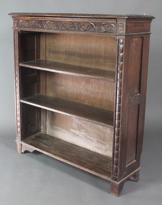 A Victorian carved oak bookcase fitted adjustable shelves having a secret drawer to the top 45"h x 42"w x 13"d 