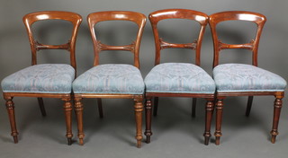 A set of 6 Victorian mahogany bar back dining chairs with carved mid rails and upholstered seats on turned supports 