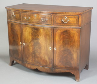 A 19th Century Georgian style bow front sideboard, the crossbanded top inlaid satinwood stringing, fitted 1 long and 2 short drawers above triple cupboards enclosed by panelled doors with ivory shield escutcheons and brass swan neck drop handles, 32 1/2"h x 42"w x 21"d 