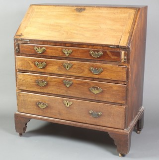 A Georgian mahogany bureau with fall front revealing a well fitted interior above 4 long graduated drawers with brass swan neck drop handles 42"h x 26"w x 20 1/2"d
