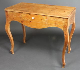 A 19th Century Continental pine side table fitted a drawer, raised on cabriole supports 30"h x 37"w x 18 1/2"