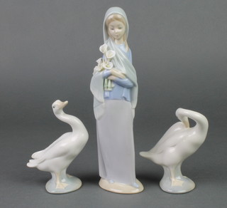 A Lladro figure of a girl holding lilies 9", 2 ditto figures of geese 4" 
