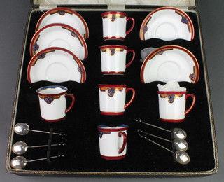 A cased Art Deco coffee set with geometric decoration and with 6 bean end silver spoons 