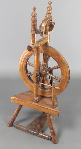 An elm spinning wheel 36"h x 15"w 