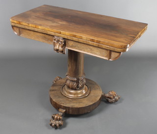 A William IV rosewood D shaped card table, raised on a turned column, circular base and paw feet 29"h x 26" x 18"d 