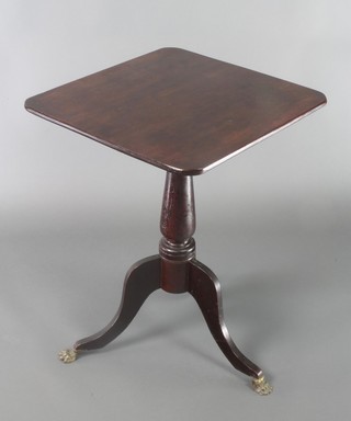 A rectangular 19th Century mahogany snap top wine table raised on a turned column and tripod base with brass paw feet 28"h x 31"w x 20 1/2"d 