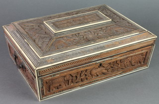 An Indian carved hardwood cushion shaped work box, the interior fitted various compartments 4"h x 12 1/2"w x 9 1/2"d
