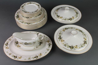 A Royal Doulton Larchmont design dinner service comprising 8 dinner plates, 7 side plates, 8 small plates, a sauce boat and stand, 2 tureens with lids