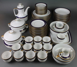 A Bavarian blue and gilt decorated coffee and dinner service comprising 12 coffee cups, 12 saucers, coffee pot, sugar bowl, cream jug, 2 tureens and covers, 2 bowls, 7 dinner plates, 12 medium plates, 2 small plates, 2 oval plates and 12 soup bowls 