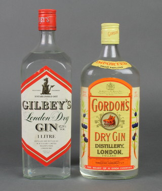 A 1 litre bottle of Gordons gin and a 1 litre bottle of Gilbey's Gin 