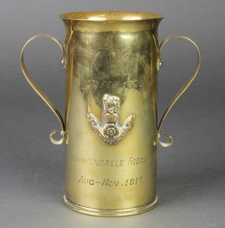 A First World War Continental Trench Art vase formed from a twin handled vase decorated the Arms of the Royal North Lancashire Regt. and engraved 10th Feb 1920 Passchendaele Range August - November 1917, 6 1/2"h  