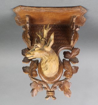 A 19th Century carved Swiss pine bracket decorated a carved deers head 13"h x 10"w 