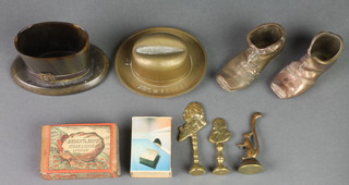 A horn match striker in the form of a top hat 2", a cast brass advertising match striker for Battersbey in the form of a homberg, 3 piper tampers and other minor sundries