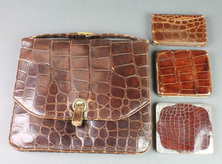 A snake skin wallet with silver mounts, 2 other snake skin wallets and a ditto handbag 