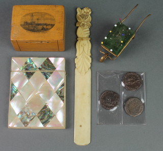 A Victorian mother of pearl card case 4" (2 panels missing), a carved ivory paper knife, a gilt metal pin cushion in the form of a wheelbarrow, a Marklin ware box decorated Wellington Pier Yarmouth 
