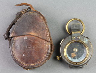 E & R Watts & Sons, a First World War prismatic compass no. 73604 1917 AE and with crows foot mark, contained in a leather case marked 2nd Lieutenant E W Faircloth