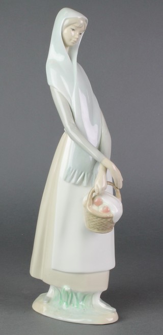 A Lladro figure of a girl with basket 18" 