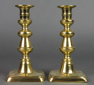A pair of 19th Century brass candlesticks with ejectors 7 1/2" 