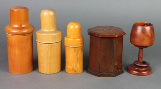 An octagonal wooden box with hinged lid 5", a turned yew goblet 5", 3 19th Century turned treen medicine bottle holders 