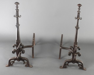 A large and impressive pair of 17th Century style wrought iron fire dogs 22"h x 28"w 