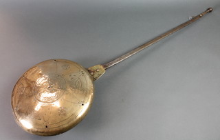 A 17th/18th Century brass warming pan the pierced and engraved lid with 3 marks and with a polished steel handle