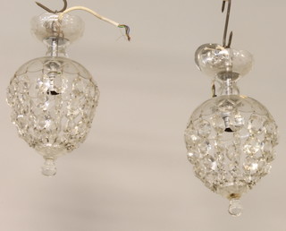 A pair of glass bag shaped light shades with lozenge decoration 12" 