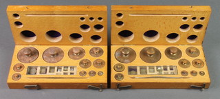 2 wooden boxes containing various wooden weights