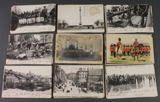 A collection of various French black and white postcards 
