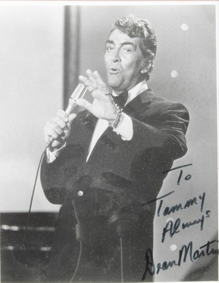 Dean Martin, a black and white hand signed photograph 8" x 10" contained in a walnut effect easel frame