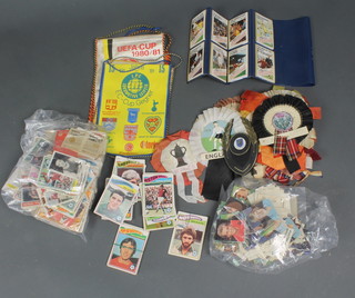 A box of football rosettes, pennants, stickers, trade cards etc