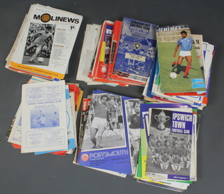 A box containing a collection of football league programmes from the 1960's - 2000