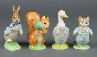 Four Beswick Beatrix Potter figures - Tom Kitten, Mr Drake Puddleduck, Peter Rabbit and Squirrel Nutkin 